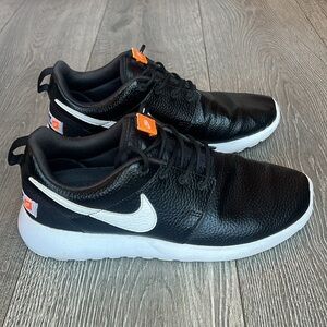 Nike Black Sneakers with White and Orange Details